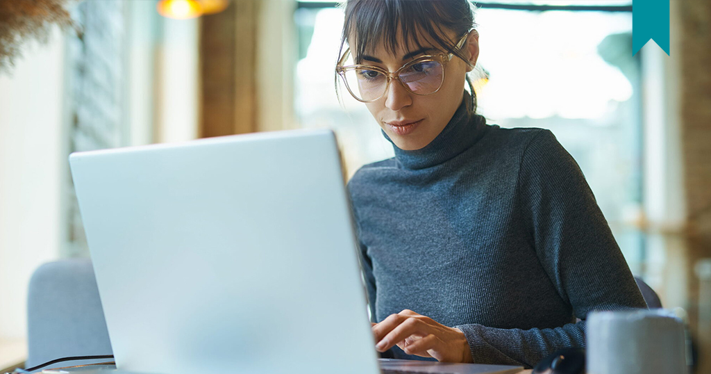 Female Tenant disputing Rent Reporting on laptop.